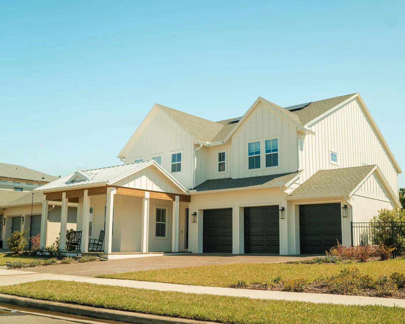 White farmhouse with large clean windows